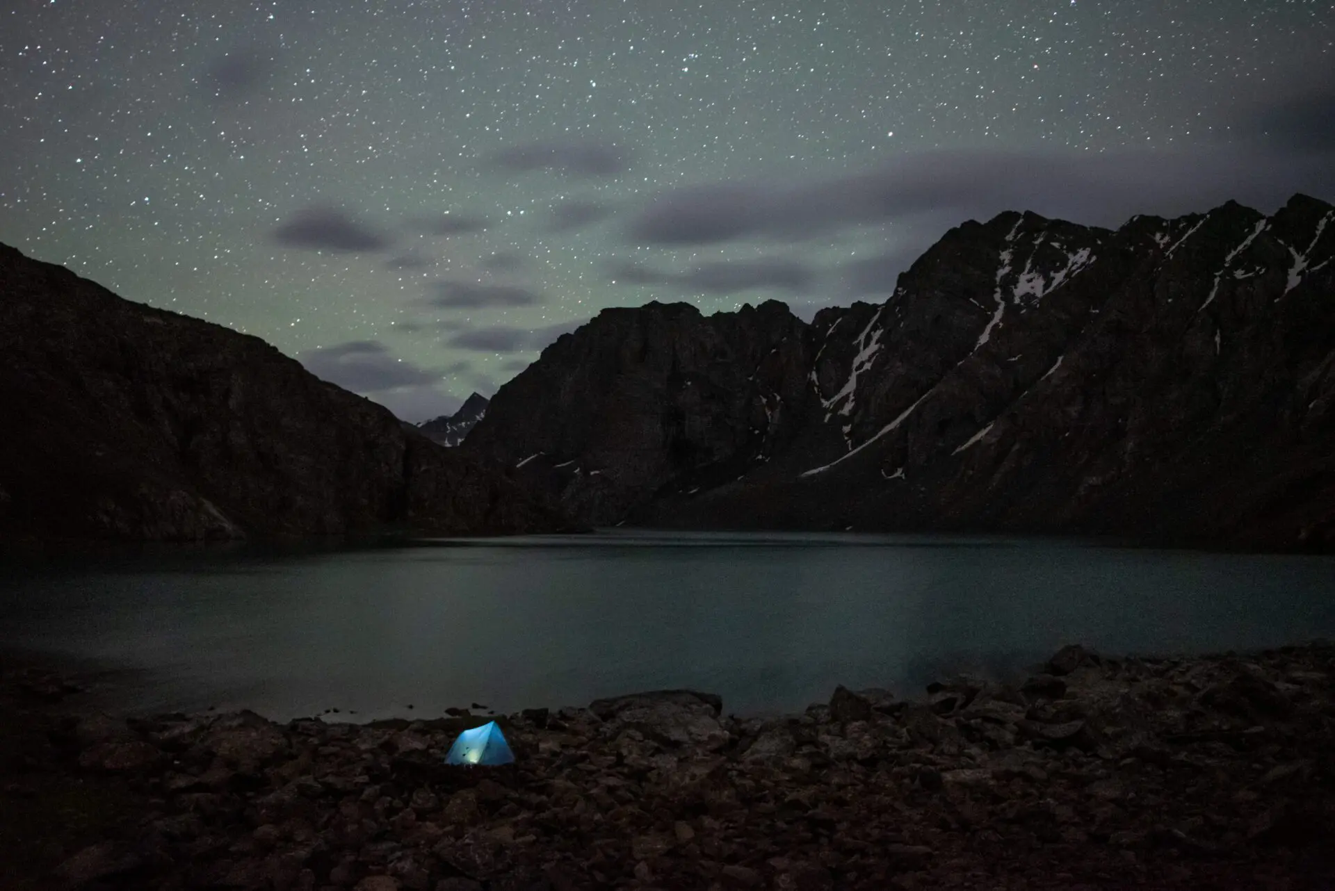 Camping by Ala Kul lake under the night sky